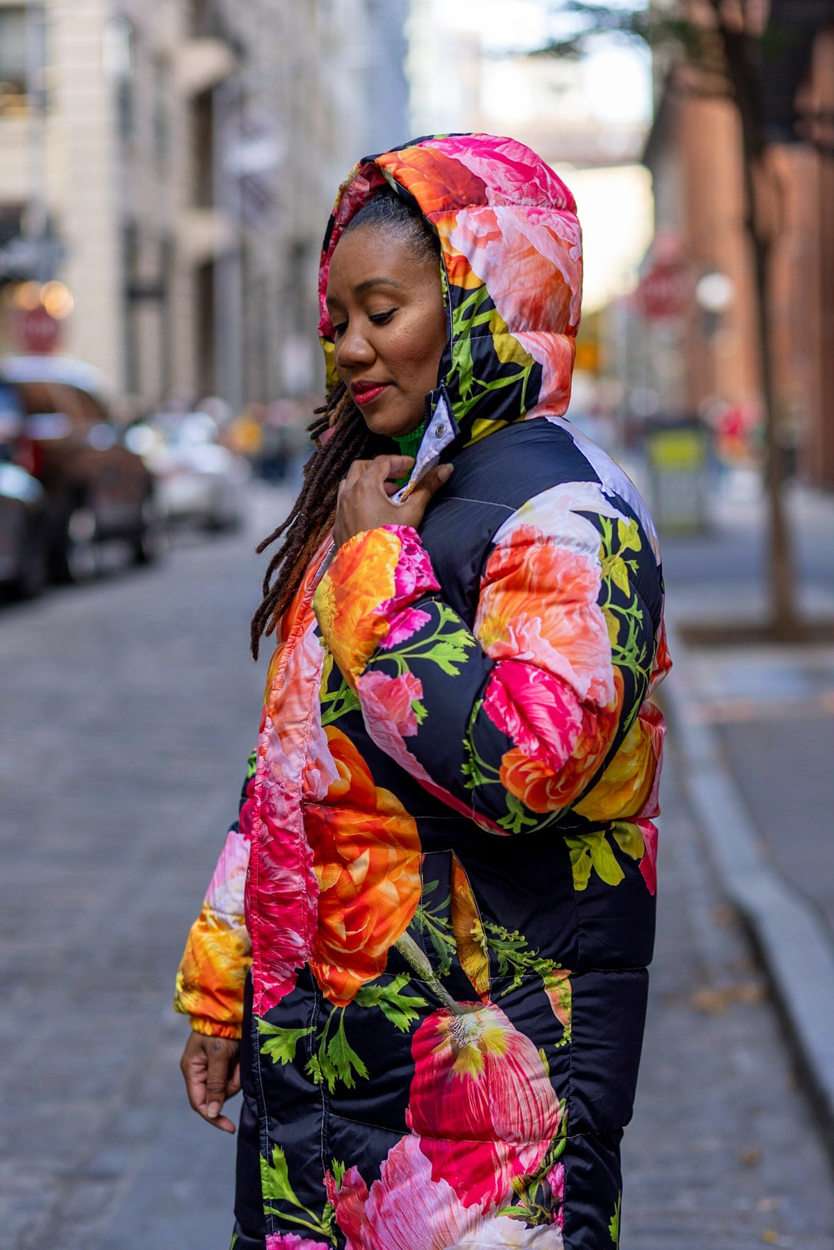 Black puffer coat with colorful florals