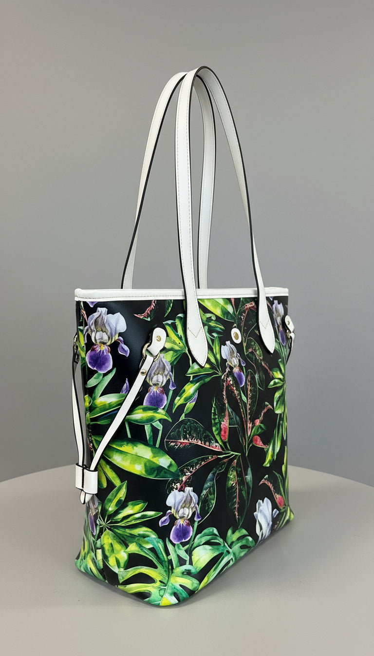 Tropical-themed bag with floral and leaf design on a marble surface