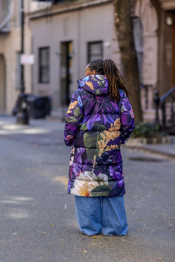 Bold, purple floral long puffer coat with hood